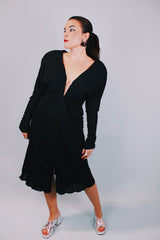 long sleeve mini black dress with deep v-neck and cinched arms 1980's vintage