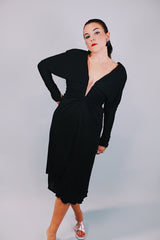 long sleeve mini black dress with deep v-neck and cinched arms 1980's vintage