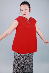 sleeveless red velvet blouse with v neck in front and back with embellished trim around neckline and bow in back 1950's vintage