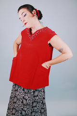 sleeveless red velvet blouse with v neck in front and back with embellished trim around neckline and bow in back 1950's vintage