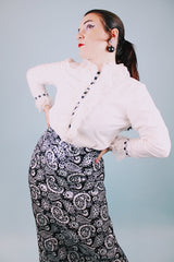 long sleeve white blouse with buttons in the back and chiffon ruffle details around cuffs and neck vintage