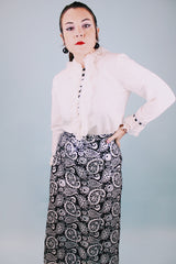 long sleeve white blouse with buttons in the back and chiffon ruffle details around cuffs and neck vintage