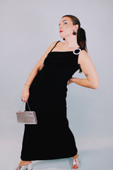 ankle length black velvet form fitting dress sleeveless with one thick strap and one thin strap and rhinestone buckle 1970's vintage