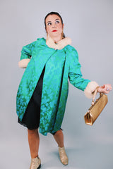 green statin long sleeve knee length jacket with floral pattern and cream faux fur trim around cuffs and neck vintage 1960's