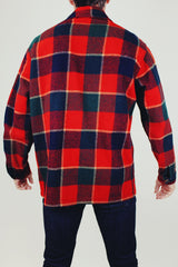 long sleeve vintage men's pendleton wool plaid jacket with collar buttons up the front and pockets in red and dark green plaid print