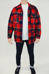 long sleeve vintage men's pendleton wool plaid jacket with collar buttons up the front and pockets in red and dark green plaid print