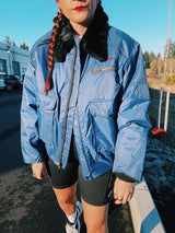 navy blue puffer jacket with black faux fur collar and zipper up the front 1970's vintage