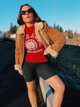 long sleeve brown suede jacket with cream shearling liner and collar zips up the front vintage 1970's