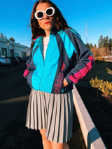 long sleeve vintage adidas 1980's sports track jacket zips up the front navy blue and magenta colors