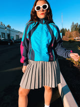 long sleeve vintage adidas 1980's sports track jacket zips up the front navy blue and magenta colors