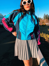 long sleeve vintage adidas 1980's sports track jacket zips up the front navy blue and magenta colors