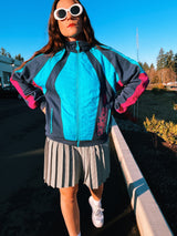long sleeve vintage adidas 1980's sports track jacket zips up the front navy blue and magenta colors