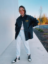 long sleeve black nylon jacket with fleece interior and East Staff wording on chest