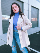 long sleeve mid length cream leather trench coat vintage 1970's with front buttons and tie waists