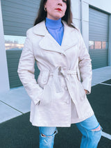 long sleeve mid length cream leather trench coat vintage 1970's with front buttons and tie waists
