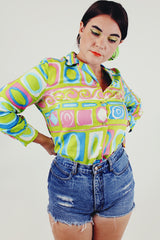 vintage printed long sleeve button up tucked in