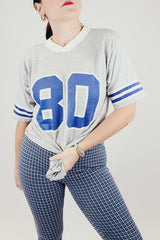 short sleeve grey vintage sports tee with v neck and 80 number graphic on front