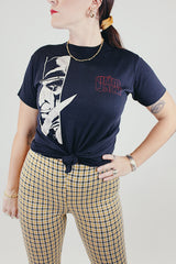 short sleeve black 1980's grim jack tee with graphic on front