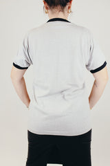 short sleeve grey with black contrast neck and arm hole ribbing vintage graphic tee 1984