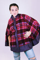 purple and pink plaid vintage women's poncho with mandarin collar, buttons, and armholes made of wool blend