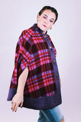 purple and pink plaid vintage women's poncho with mandarin collar, buttons, and armholes made of wool blend