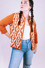 knitted open sweater women's vintage in burn orange with white aztec print