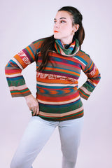 women's vintage long sleeve cowl neck sweater with multi colored stripes and print