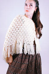 women's vintage short poncho with fringed hem and button closure in cream color