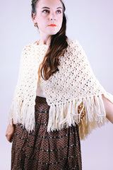 women's vintage short poncho with fringed hem and button closure in cream color