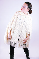 women's 1970's vintage cream acrylic knitted crochet poncho with fringed hem, collar, and buttons