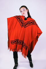 1970's vintage red wool poncho with abstract velvet trim pattern and fringe hem