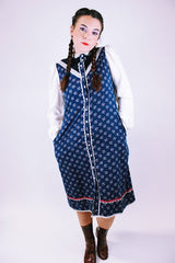 1970's vintage gunne sax prairie dress with navy floral body and white sheer sleeves buttons up the front