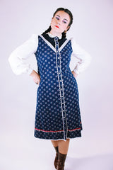 1970's vintage gunne sax prairie dress with navy floral body and white sheer sleeves buttons up the front