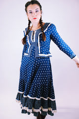 women's vintage 1970's prairie dress in navy blue with ditsy floral print cream crochet trim throughout tie waist and two tiered skirt