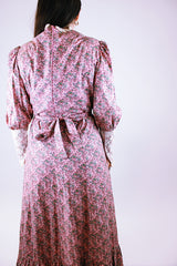 women's vintage 1950's prairie dress in pink with ditsy floral print and cream crochet lace throughout ties waist and tie bust maxi with ruffle hem