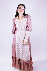 women's vintage 1950's prairie dress in pink with ditsy floral print and cream crochet lace throughout ties waist and tie bust maxi with ruffle hem