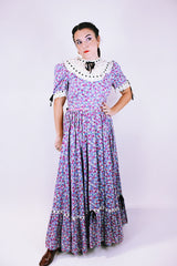 purple floral 1950's prairie dress with large full skirt and black ribbon bows