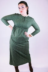 long vintage 1960's green dress with ditsy floral print long sleeves and crochet trim at neck and cuffs