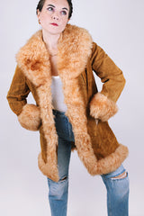 women's vintage 1970's suede leather jacket with faux fur around edges, hem, and cuffs