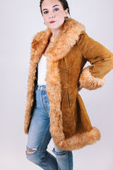 women's vintage 1970's suede leather jacket with faux fur around edges, hem, and cuffs