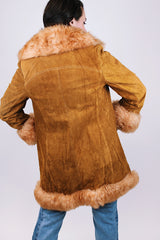 women's vintage 1970's suede leather jacket with faux fur around edges, hem, and cuffs