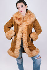 women's vintage 1970's suede leather jacket with faux fur around edges, hem, and cuffs