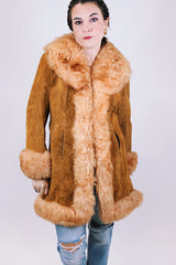 women's vintage 1970's suede leather jacket with faux fur around edges, hem, and cuffs