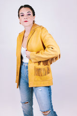 tan women's vintage 1970's genuine leather jacket with fringe, pockets, and double lapel