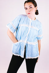 short sleeve baby blue 1970's women's vintage button up blouse with crochet lace throughout