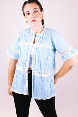 short sleeve baby blue 1970's women's vintage button up blouse with crochet lace throughout