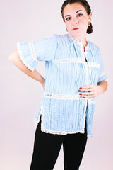 short sleeve baby blue 1970's women's vintage button up blouse with crochet lace throughout