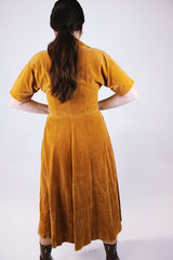 short sleeve women's vintage 1950's mustard yellow velvet dress midi length with collar and buttons in the front
