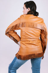 women's vintage leather jacket in camel collar with fringe trim detail, a tie waist, and buttons up the front