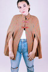 women's vintage tartan printed poncho in tan and red with buckle closure and mandarin collar